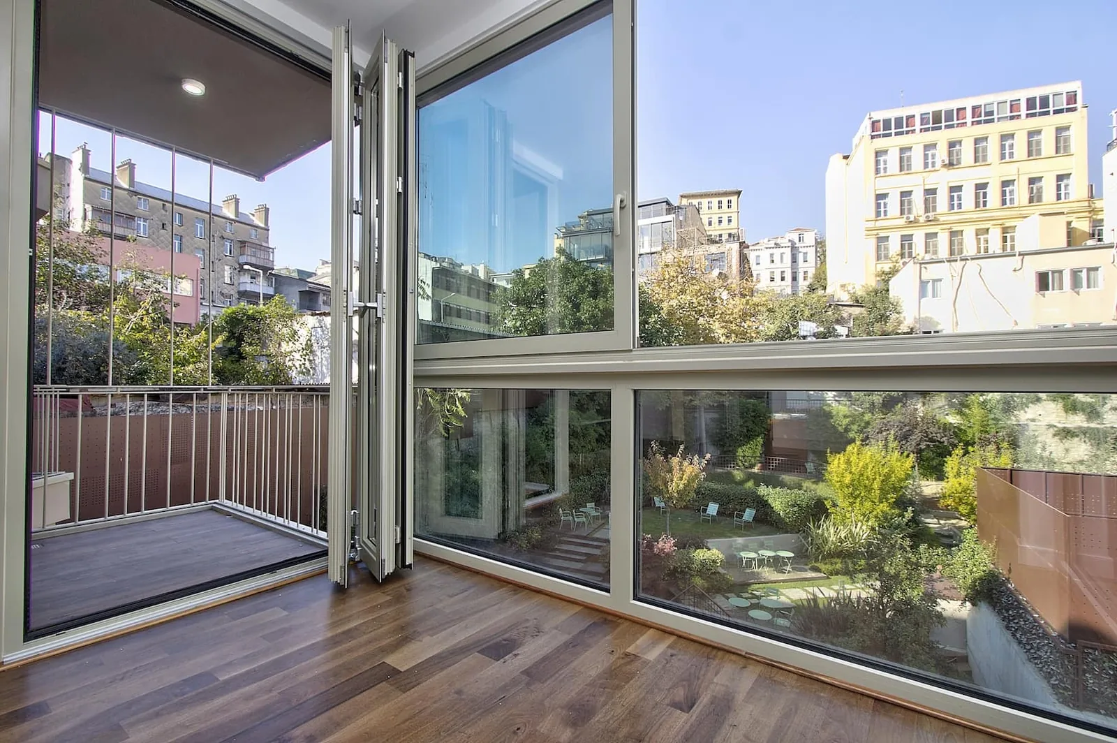 Hacımimi Gardens, Beyoğlu, an apartment overlooking a garden and historic buildings