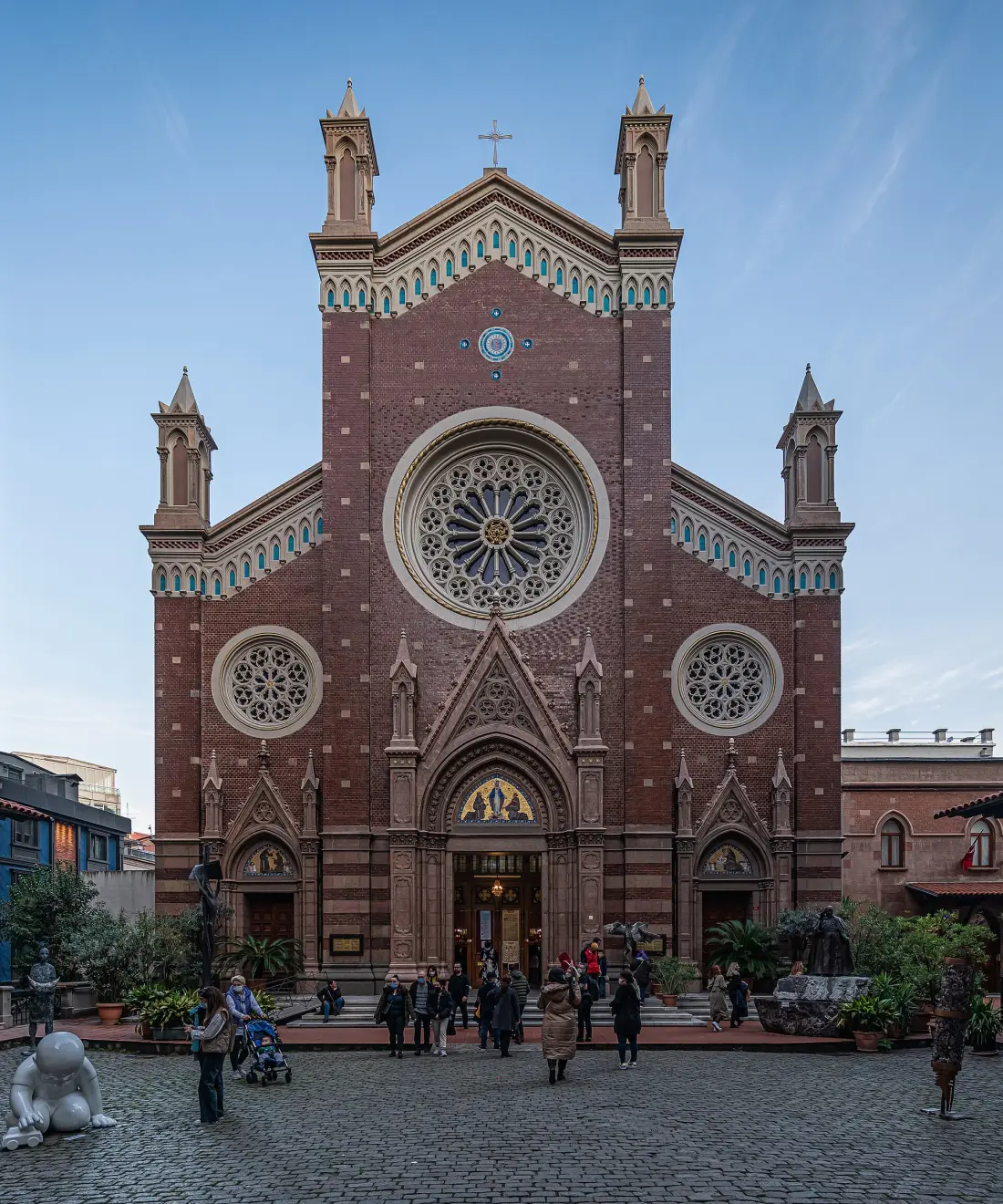 The neo-Gothic brick façade of St. Anthony's with its rose window